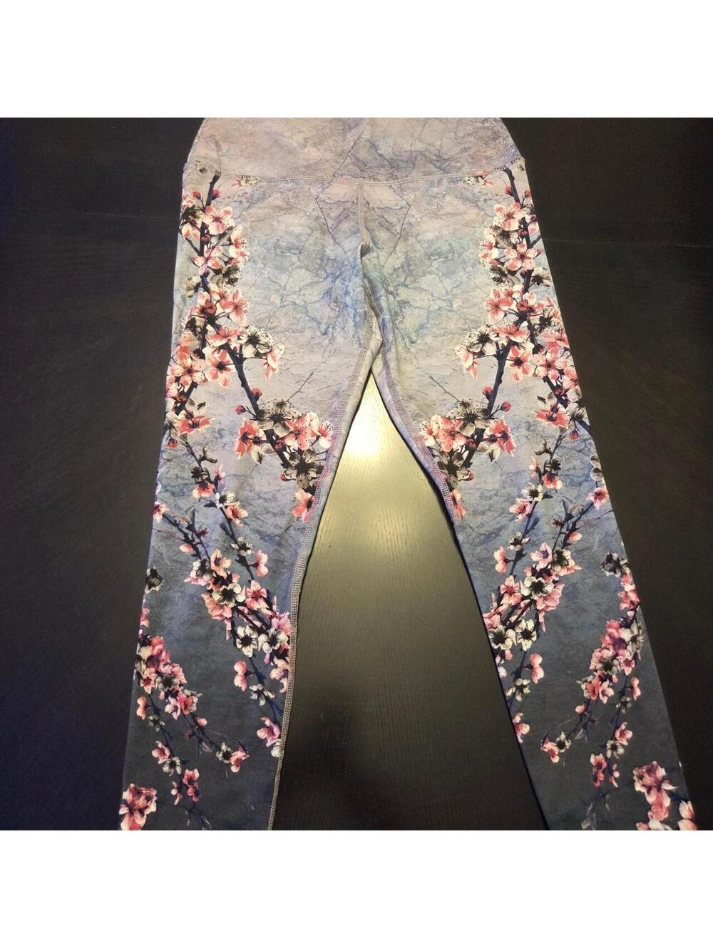 Evolution and Creation pink cherry blossom print yoga leggings with blue marble